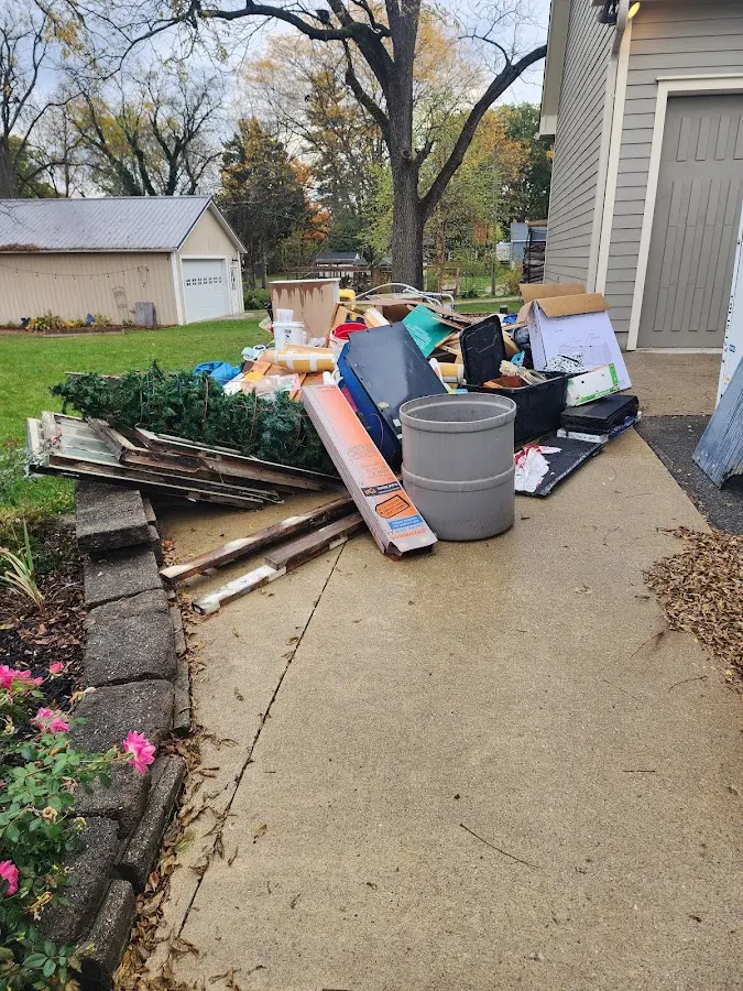 Dumpster being loaded with debris for 30 Yard Dumpster Rental in Fair Oaks